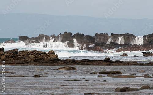 PLaya pantai Karang Beurem oleaje y sus cascadas de agua. Sawarna, Lebak Regency, Banten, Indonesia photo