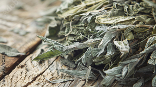 An upclose look at a bundle of dried mugwort a common Chinese herb used in acupuncture with its feathery leaves and distinctive aroma. photo
