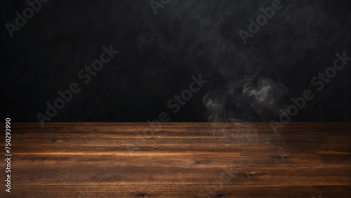 empty wooden table with smoke float up on dark background Empty Space for products display