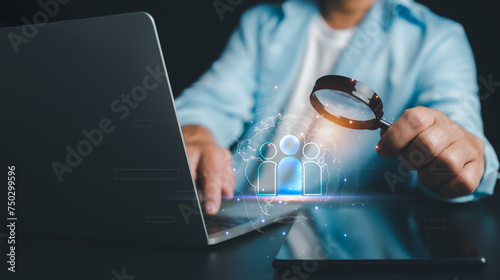 HRM, human manage, Businessman use magnifying glass to find human icon for business CRM or Customer Relation Management and customer focus target group concept, social media, Digital marketing online.