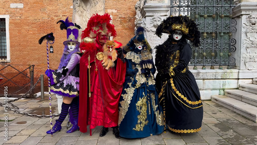 Venice Carnival. People in Venetian carnival masks and costumes on streets of Venice, Italy, Europe February 10, 2024 © frolova_elena