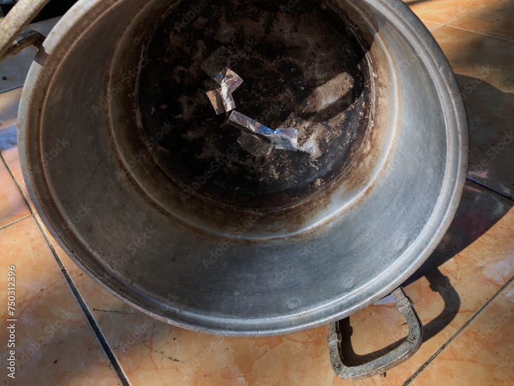 old aluminum pot boiling water