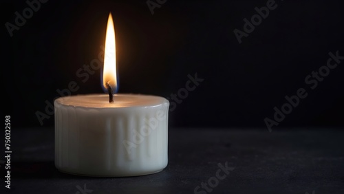 burning candle on dark background, copy space for text, white candle.