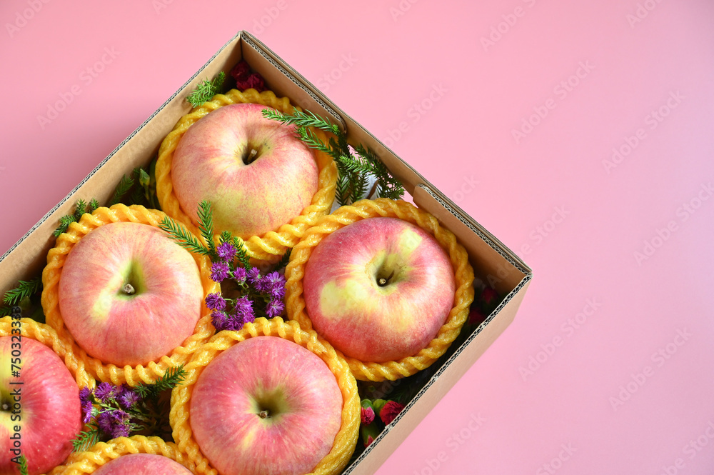 beautiful apple in the box on pink backgrond, healthy fruit beautiful apple in the box on pink backgrond, healthy fruit