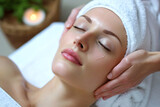 Facial massage concept. Young girl with closed eyes and perfect skin, towel on head. Skin care, spa treatment.