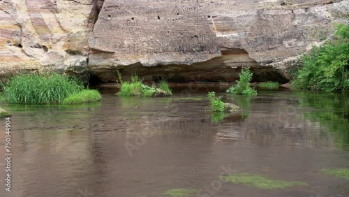 Panorama of the Ahja River in front of the sandstone outcrop of the Large Taevaskoja. photo