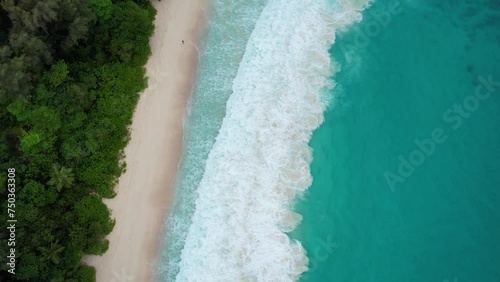 The Grand Anse Intendance beach with surf filmed from above. photo