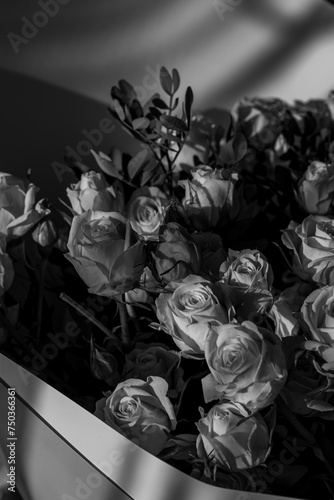 Black and white photo of a bouquet of spray roses. photo
