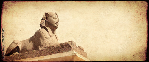 Grunge background with paper texture and sphinx statue. Horizontal banner with ancient egyptian sphinx in Alexandria. Copy space for text. Mock up templat photo