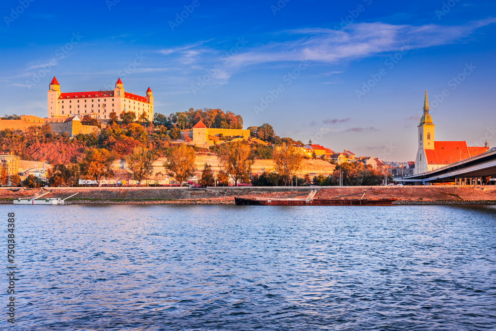 Bratislava, Slovakia. Bratislava Castle and old town over Danube River, sunrise light.
