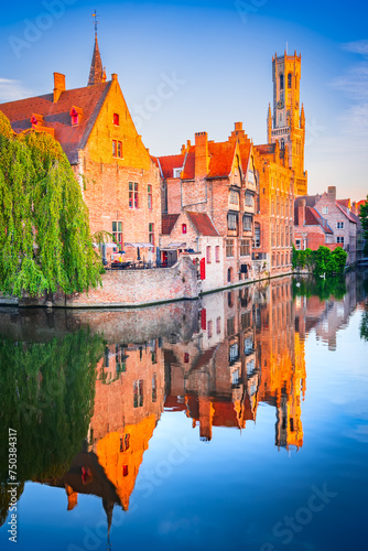Bruges, Belgium. Rozenhoedkaai in sunrise light, old town with Belfry water reflection photo