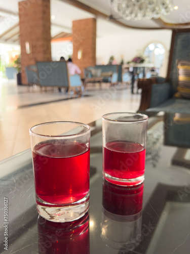 Kokum Sharbat Juice or Sherbet in Goa summer coolant drink made up of Garcinia indica with raw fruit served in a glass. Goan drink photo