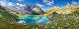 high mountain lake in the alps framed by high mountains, generated image