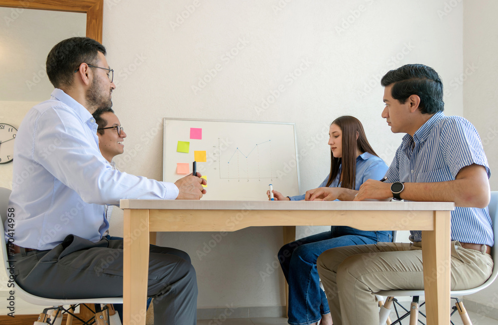 A group of people sitting at a table A group of people sitting at a table