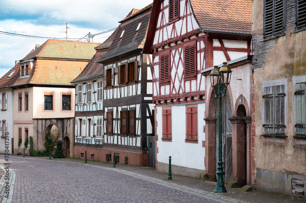 Fototapeta premium Road in the Alsace in France, Oberbronn with old house, town of storks, timbered houses