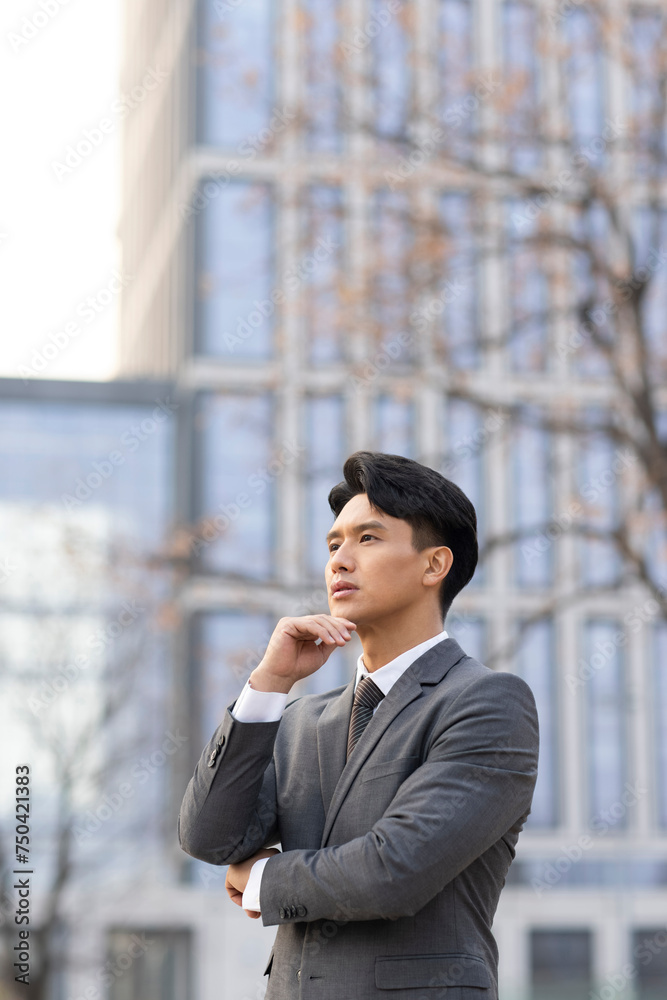 Confident businessman looking at view Confident businessman looking at view