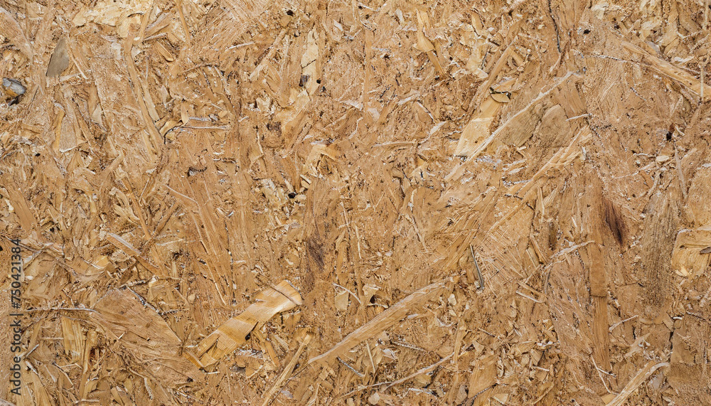 OSB, board texture and background of pressed sandy brown particle board, closeup. OSB, board texture and background of pressed sandy brown particle board, closeup.