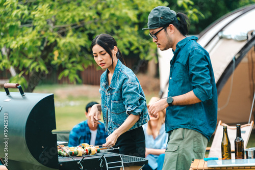 Group of diverse friend having outdoors bbq party together, camping activity lifestyle in summer, cooking fun and happy together with friends or family person group having relax in vacation time