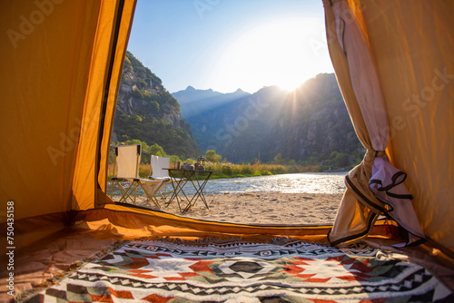 Camping tent by the river photo