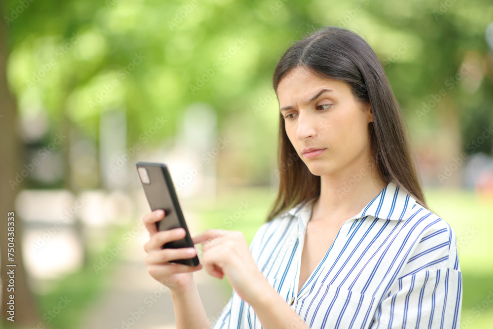 Suspicious woman checking strange news on phone Suspicious woman checking strange news on phone