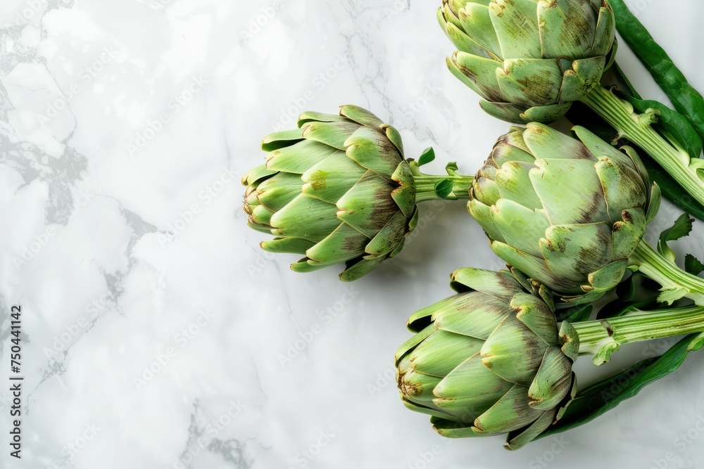 Obraz premium Fresh raw organic farm one artichoke on white marble background top view, healthy artichokes in balanced nutrition and cooking concept 
