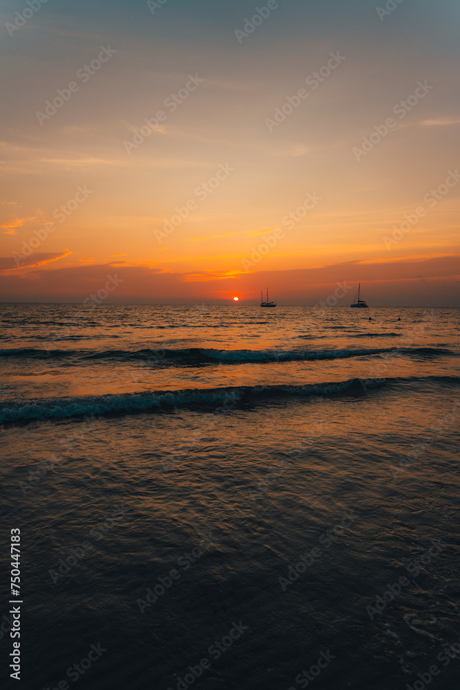 Orange beach at summer dusk on the island