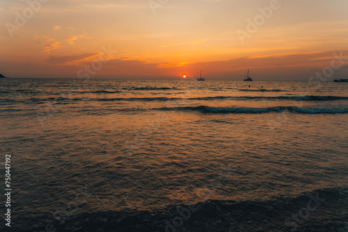 Orange beach at summer dusk on the island