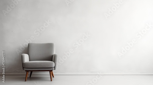 A Gray chair set against the purity of a white room