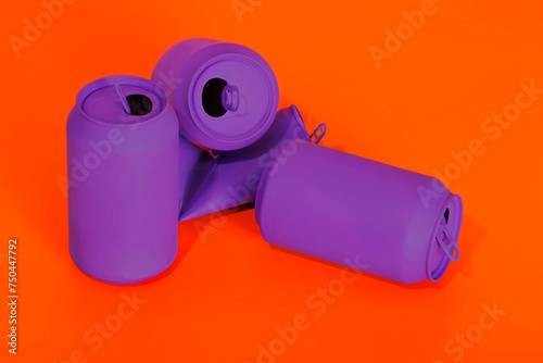 Crumpled purple cans on vibrant red background photo