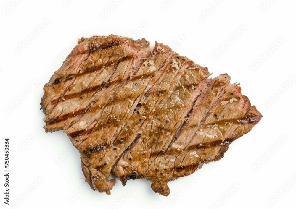 Top-down view of minimally seasoned carne asada sliced and isolated on a white background. Grilled beef steak concept for menu design and culinary websites