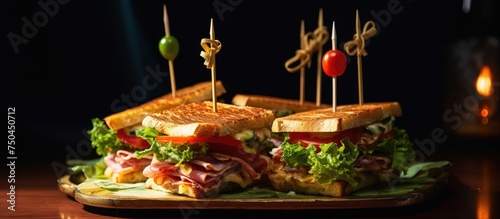 Delicious Ham and Cheese Toasted Sandwich on Plate with Lettuce, Tomato, and Utensils