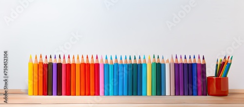 Vibrant Colored Pencils Arranged on Wooden Table Ready for Creative Artwork