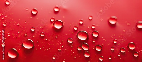 Vibrant Red Raindrops Creating Abstract Patterns on Textured Surface in High Definition