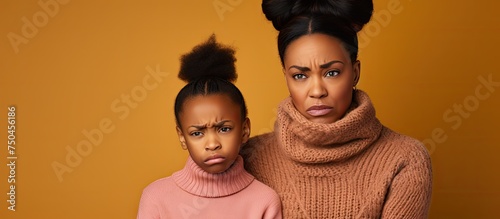Two Women in Sweaters and Scarves Reacting with Disgust and Aversion