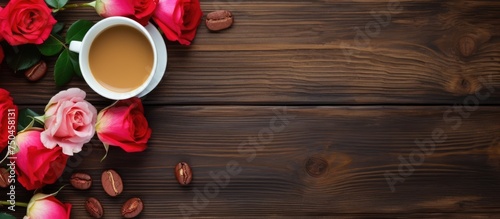 Rustic Charm: A Coffee Cup Nestled Amongst Blooming Roses on a Weathered Wooden Table