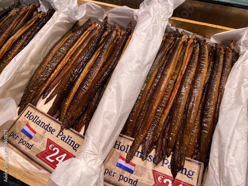 Smoked eel for sale at a display at a fish smokehouse and fish shop in the Netherlands