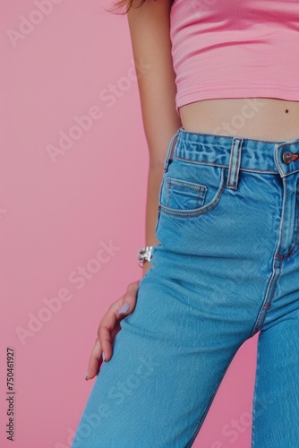 A woman wearing a pink top and blue jeans, suitable for lifestyle or fashion concepts