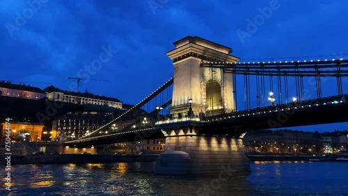 Chain bridge. Night view of the old town. The bridge and buildings of the old town seen from the river. Budapest, Hungary