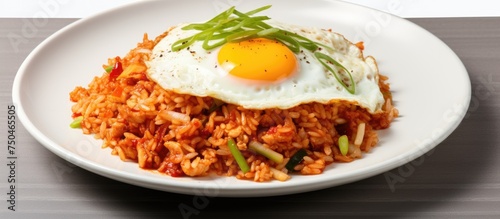 Savory Korean Kimchi Fried Rice Served with a Crispy Egg on Ceramic Plate