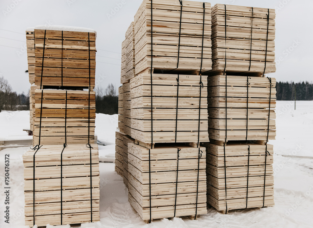 wooden plank bundles outside in winter wooden plank bundles outside in winter