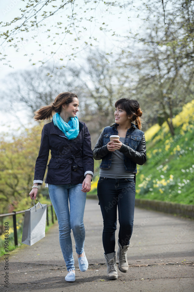 Fototapeta premium Caucasian and Asian girlfriends having fun together.