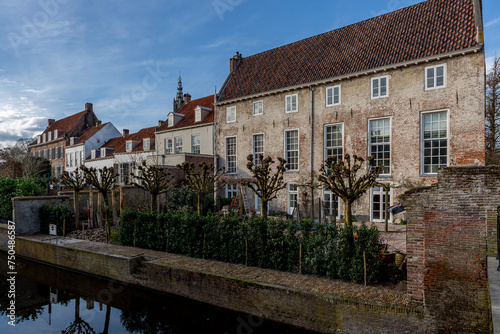 Sideview of large mansion and former home of Dutch statesman Johan Van Oldenbarnevelt in historic city center on canal