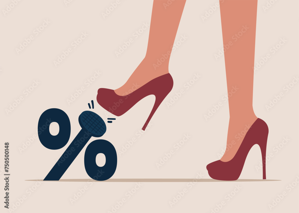 Φωτογραφία Woman kicking foot hard to nailed percentage sign to the floor