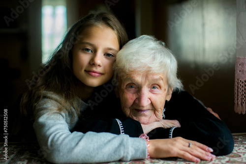 Portrait of a girl with her old grandmother.