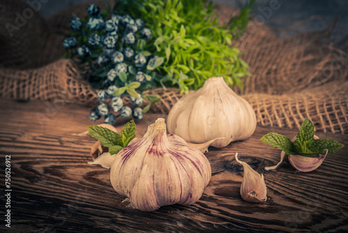 A head of garlic in a rustic arrangement