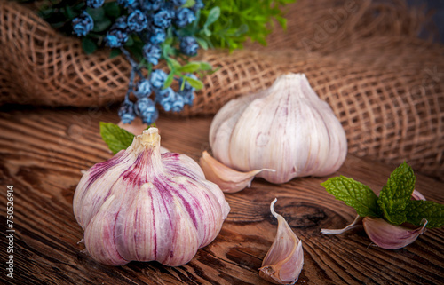 A head of garlic in a rustic arrangement