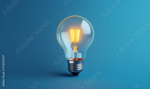 Illuminated Lightbulb Against Blue Background
