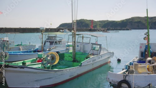 Small Japanese Harbor in on Bright Sunny Day in Osatsu Town, Mie Prefecture photo