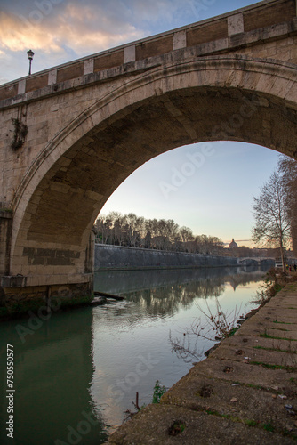 View of Ponte Sisto. It is a bridge in Rome's historic centre, Italy, spanning the river Tiber. In the background the dome of St. Peter's Basilica at sunset. © Stefano Tammaro