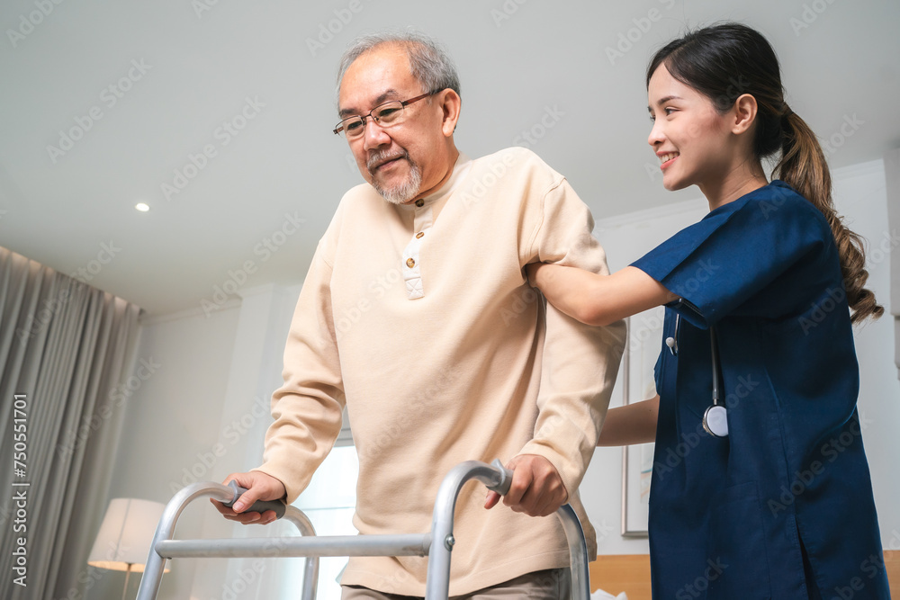 Fototapeta premium Asian physiotherapist nursing home to support old senior man patient therapy by walker, caregiver nurse help recovery health care with elderly retirement man person at home, health insurance concept